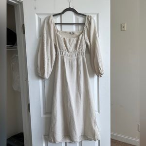 Cream midi dress | slit on side, open back detail. Square neck.